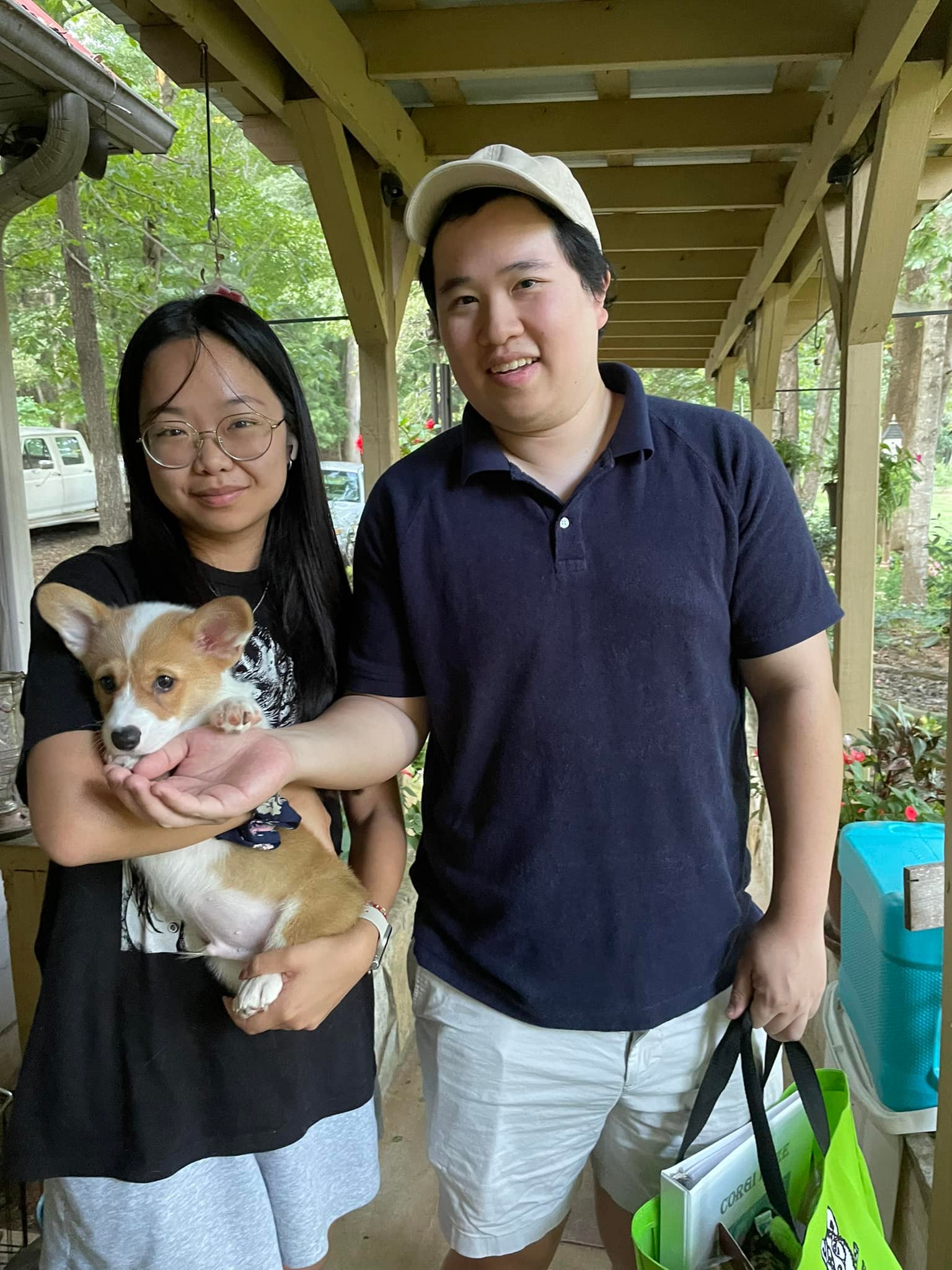 Family with new male red and white pembroke welsh corgi puppy in NC