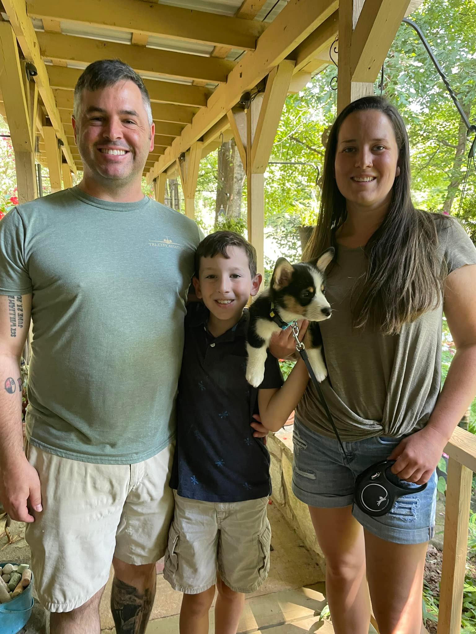 Happy family with new female tri-color pembroke welsh corgi puppy in NC