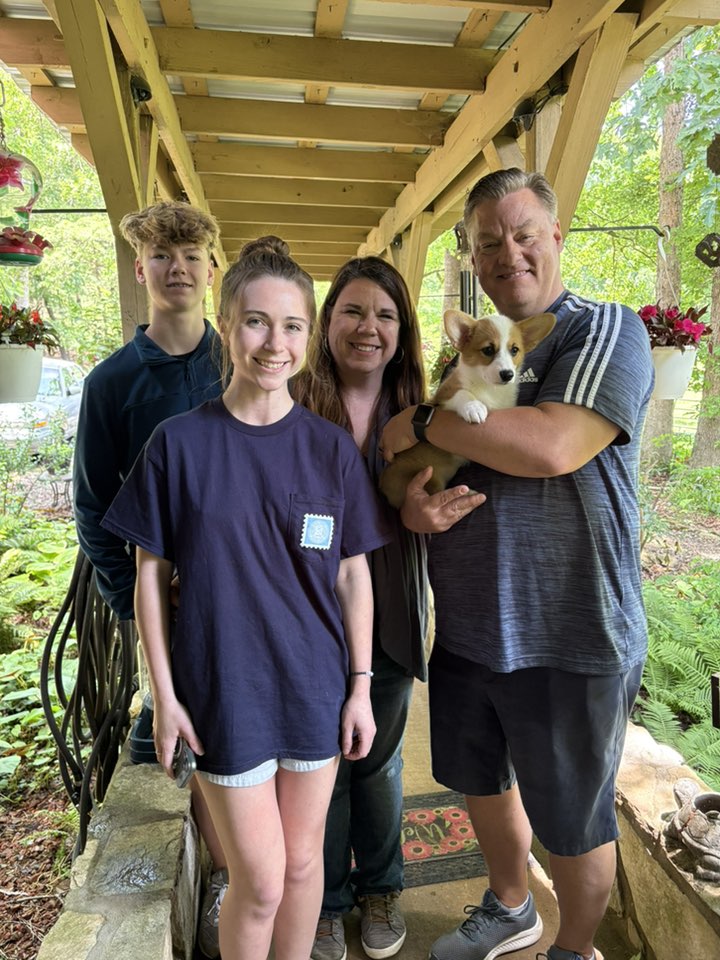 Happy family with new red and white pembroke welsh corgi puppy in NC