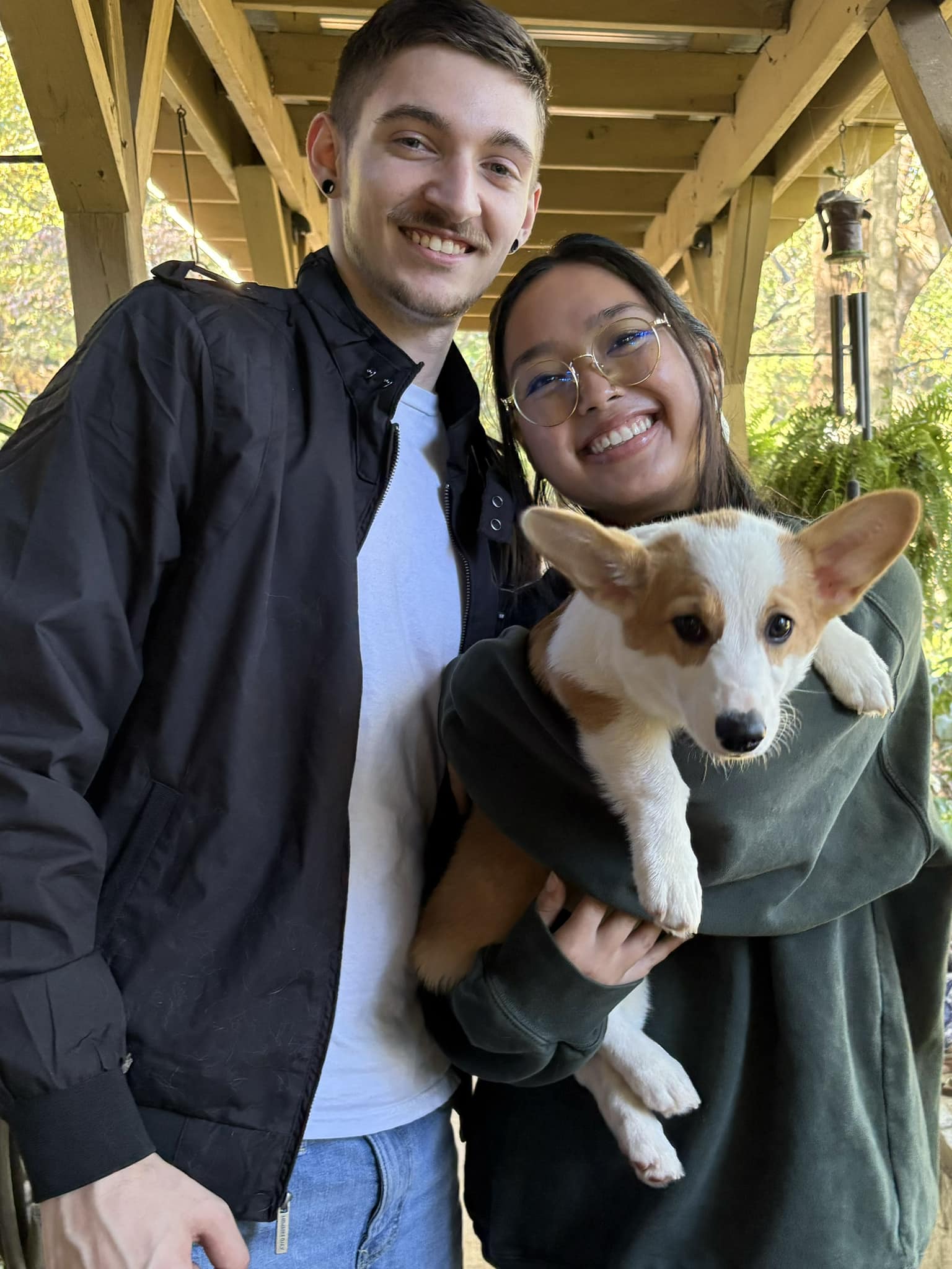 Happy couple with new female red and white pembroke welsh corgi puppy in NC
