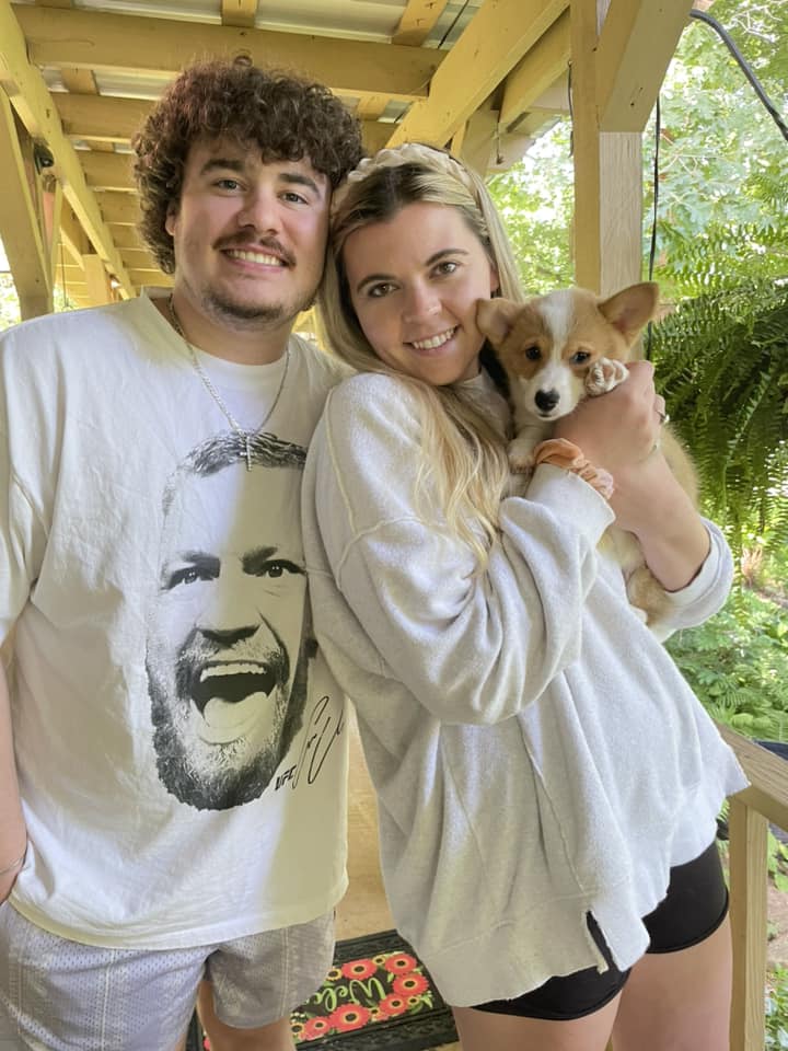 Family with new male red and white pembroke welsh corgi puppy in NC